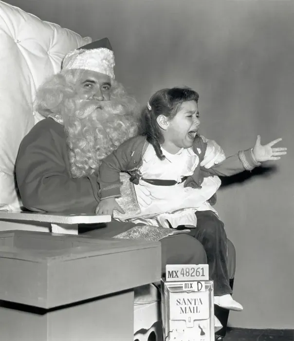 Framed Print : Girl Crying While Seated on Santa's Lap Framed Print : Girl Crying While Seated on Santa's Lap
