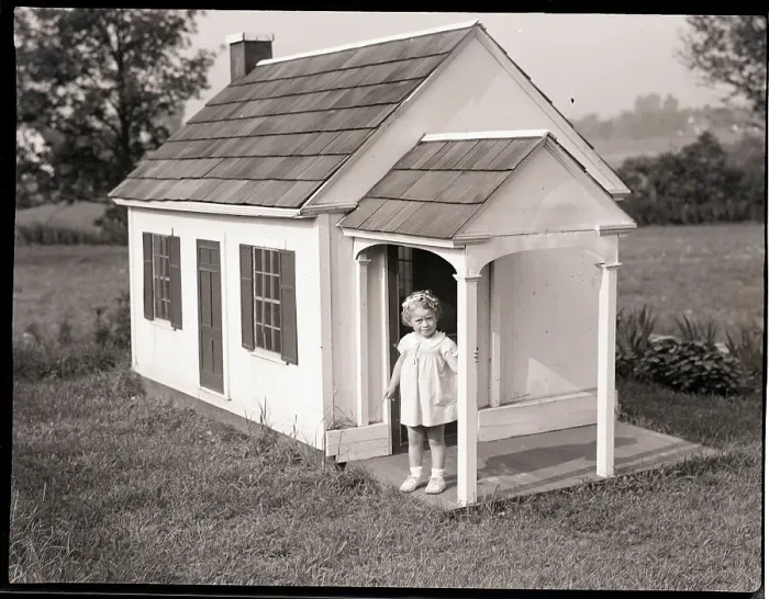 Framed Print : Girl In Dollhouse On Lawn Framed Print : Girl In Dollhouse On Lawn