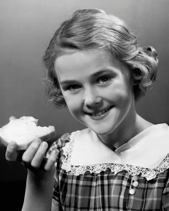 Framed Print : Girl eating bread Framed Print : Girl eating bread