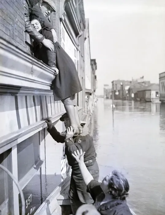 Framed Print : Girl Being Helped From Building; Flood Framed Print : Girl Being Helped From Building; Flood