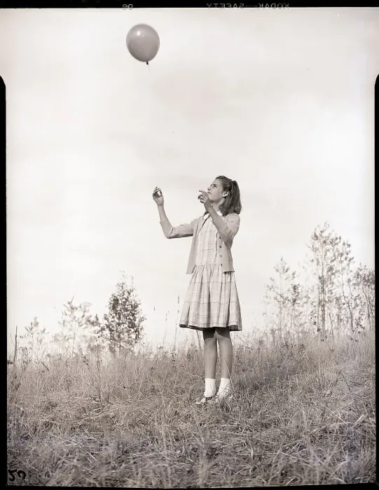 Framed Print : Girl Holding a Balloon Framed Print : Girl Holding a Balloon