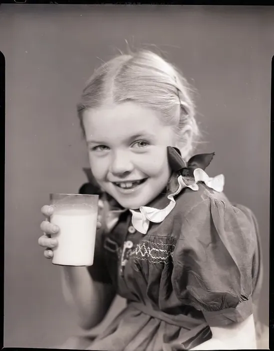 Framed Print : Girl Holding a Glass of Milk Framed Print : Girl Holding a Glass of Milk