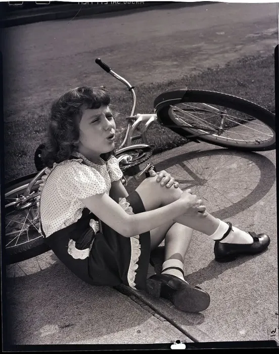 Framed Print : Girl Holding Leg After Falling off Bike Framed Print : Girl Holding Leg After Falling off Bike