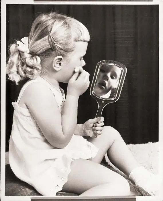 Framed Print : Girl Holding a Mirror Framed Print : Girl Holding a Mirror