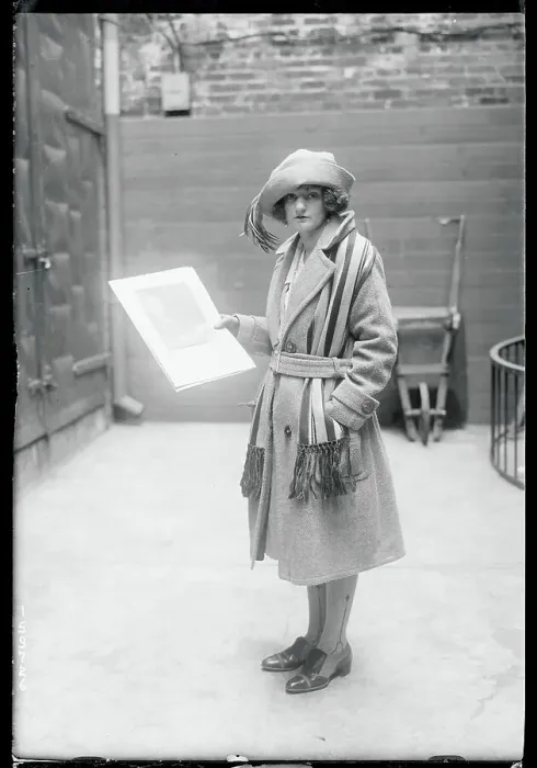 Framed Print : Girl Holding a Photograph Framed Print : Girl Holding a Photograph