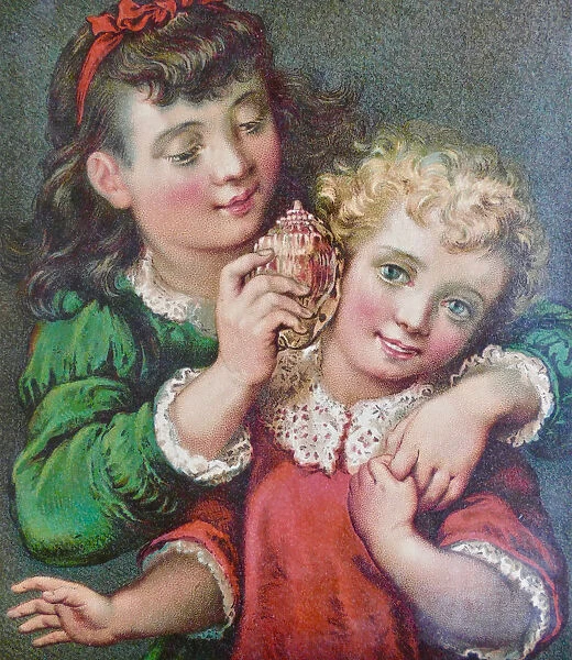 Girl holding a shell at the ear of her sister