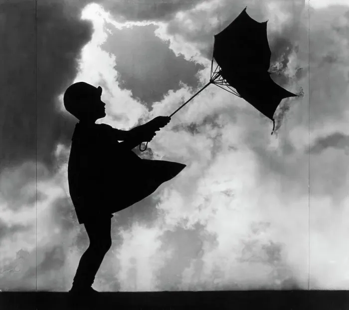 Framed Print : Girl Holding Windswept Umbrella Framed Print : Girl Holding Windswept Umbrella