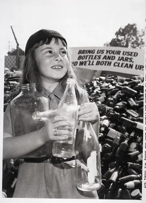 Framed Print : Girl Holds Bottles Stands By Bottle Pile Framed Print : Girl Holds Bottles Stands By Bottle Pile