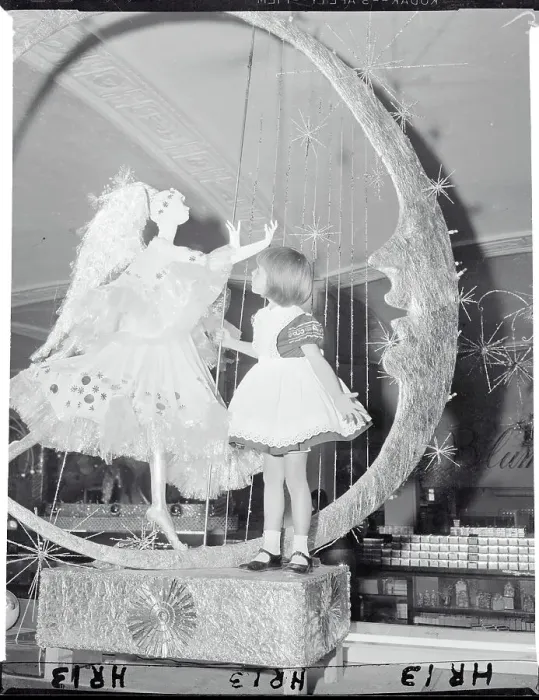 Framed Print : Girl Looking at Christmas Display with Angel Framed Print : Girl Looking at Christmas Display with Angel