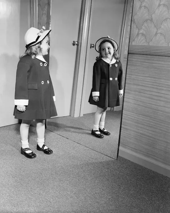 Framed Print : Girl Looking at Easter Outfit in Mirror Framed Print : Girl Looking at Easter Outfit in Mirror