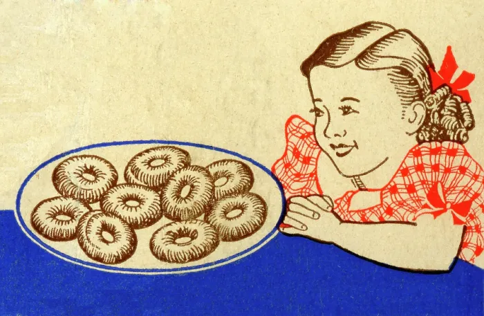 Framed Print : Girl looking at plat of doughnuts