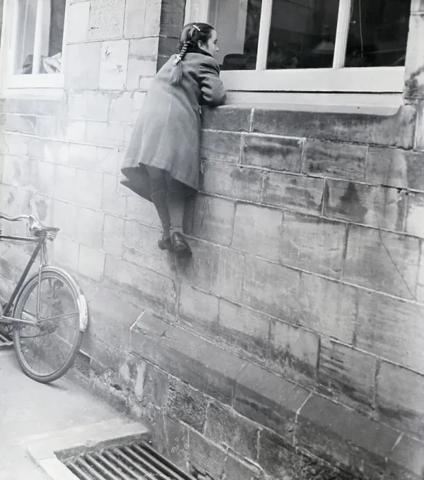 Framed Print : Girl Looks Into Window Of Building Framed Print : Girl Looks Into Window Of Building