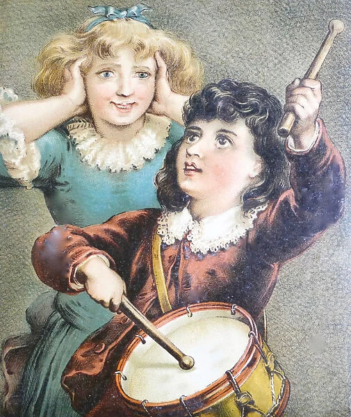 A girl making music with a drum, another girl holding the ears closed with her hands