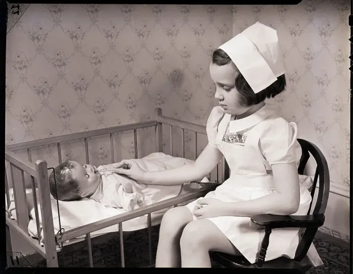 Framed Print : Girl Playing Nurse Framed Print : Girl Playing Nurse