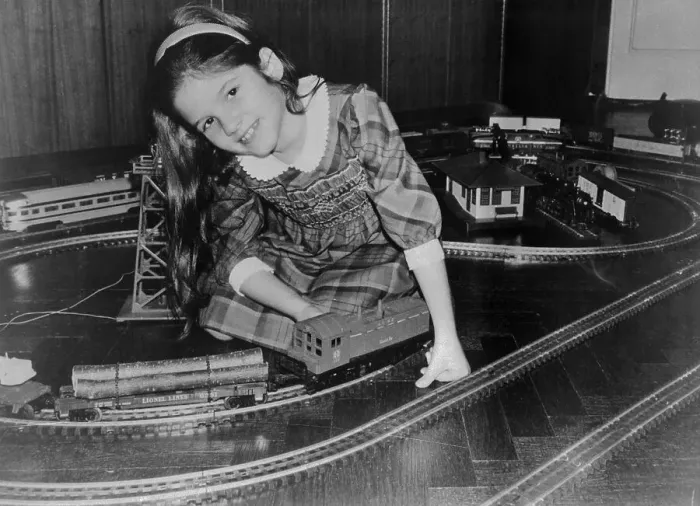 Framed Print : Girl Playing with Toy Trains Framed Print : Girl Playing with Toy Trains