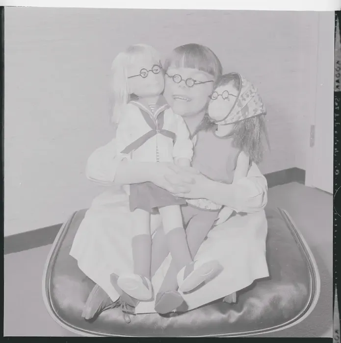 Framed Print : Girl Posing with Dolls Framed Print : Girl Posing with Dolls