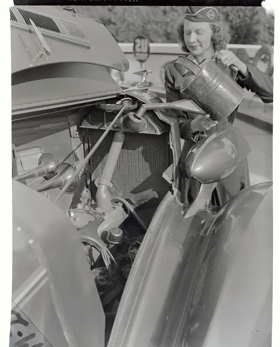 Framed Print : Girl Pouring Water into Car Radiator Framed Print : Girl Pouring Water into Car Radiator
