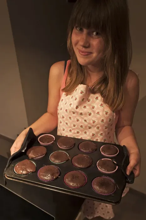 Framed Print : Girl presenting her homemade Oreo brownie cupcakes Framed Print : Girl presenting her homemade Oreo brownie cupcakes