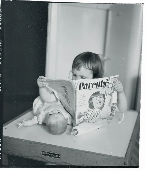 Framed Print : Girl Reading Parents Magazine