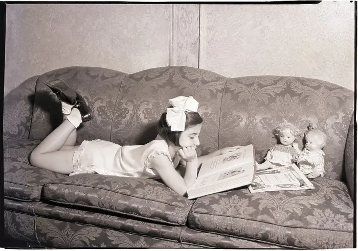 Framed Print : Girl Reading on Sofa Framed Print : Girl Reading on Sofa