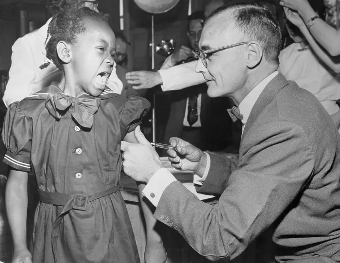 Framed Print : Girl Receiving Polio Vaccine