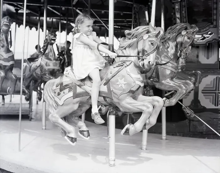 Framed Print : Girl Riding a Carousel Framed Print : Girl Riding a Carousel