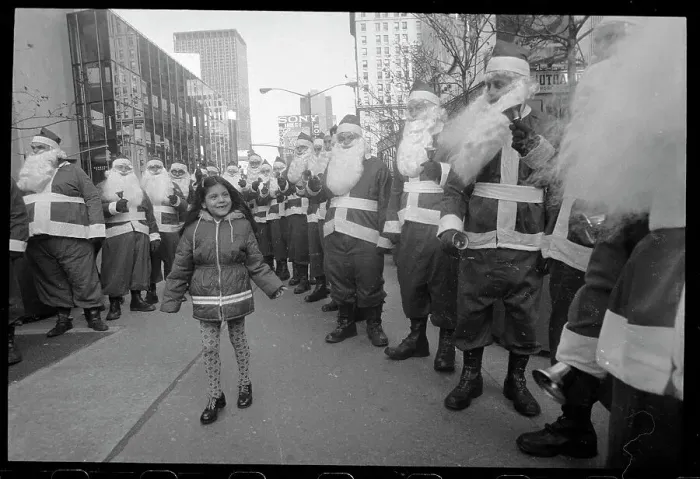 Framed Print : Girl Surrounded by Santa Clauses Framed Print : Girl Surrounded by Santa Clauses