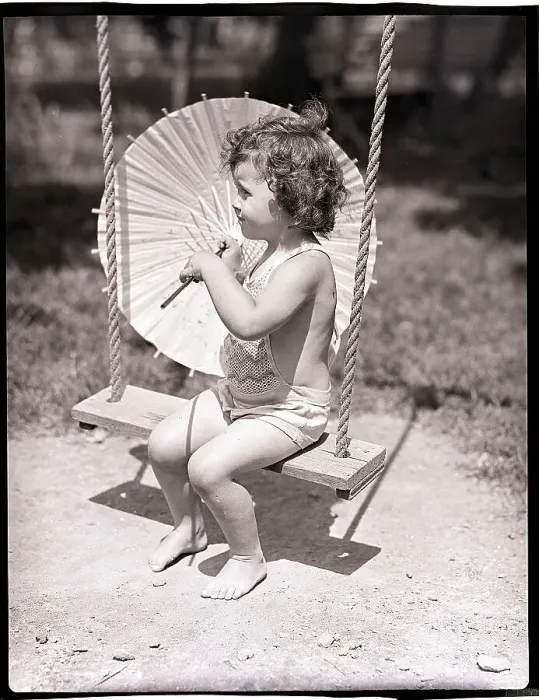 Framed Print : Girl on Swing Holding Parasol Framed Print : Girl on Swing Holding Parasol
