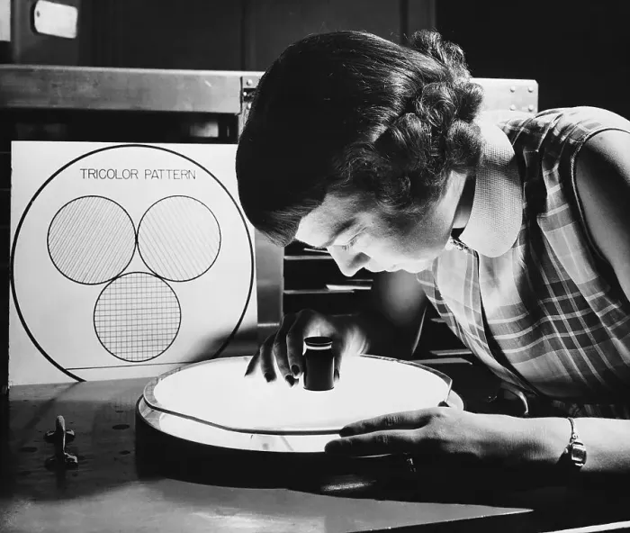 Framed Print : Girl Technician Looking at Tricolor Patte Framed Print : Girl Technician Looking at Tricolor Patte