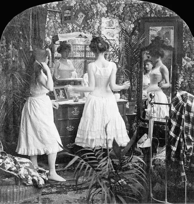 Framed Print : Girl Trying On A French Corset Framed Print : Girl Trying On A French Corset