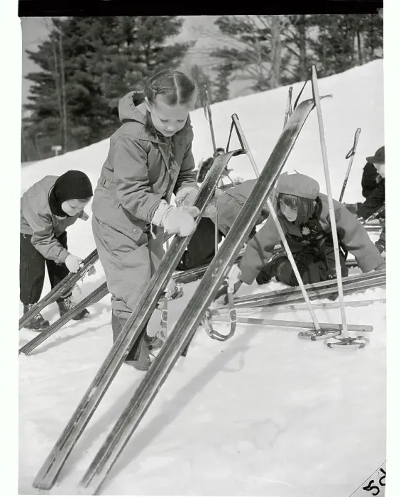 Framed Print : Girl Waxing Her Skis Framed Print : Girl Waxing Her Skis