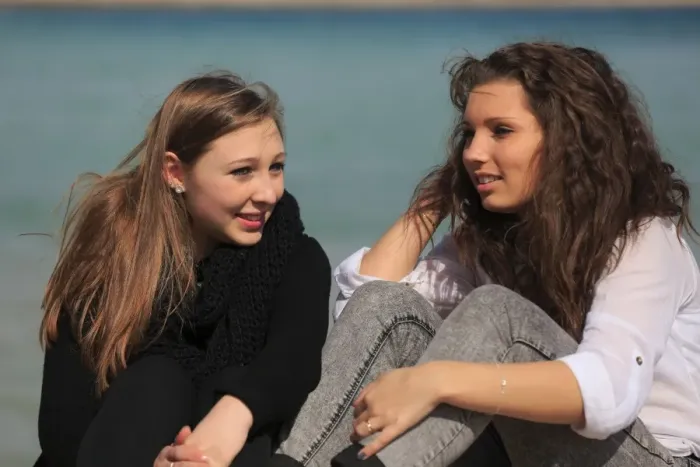 Framed Print : Two girlfriends, teenagers sitting on the beach, Menton, Alpes-Maritimes, Provence Alpes, France Framed Print : Two girlfriends, teenagers sitting on the beach, Menton, Alpes-Maritimes, Provence Alpes, France