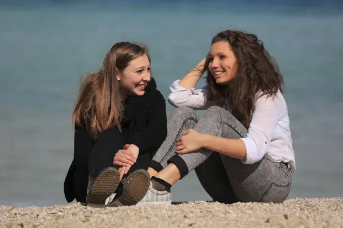 Framed Print : Two girlfriends, teenagers, sitting on the beach, Menton, Alpes-Maritimes, Provence Alpes, France Framed Print : Two girlfriends, teenagers, sitting on the beach, Menton, Alpes-Maritimes, Provence Alpes, France