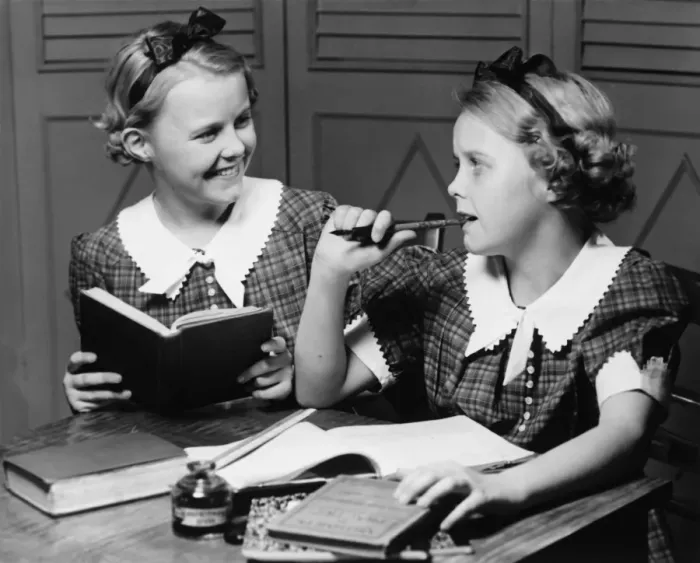 Framed Print : Two girls (10-11) doing homework (B&W) Framed Print : Two girls (10-11) doing homework (B&W)
