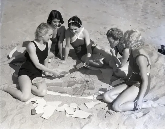 Framed Print : Girls On Beach Working On Puzzle Framed Print : Girls On Beach Working On Puzzle