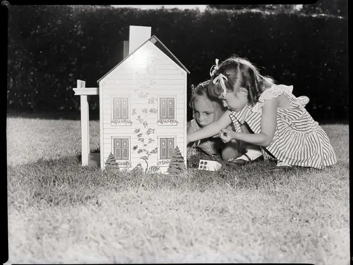 Framed Print : Girls Playing with Dollhouse Framed Print : Girls Playing with Dollhouse