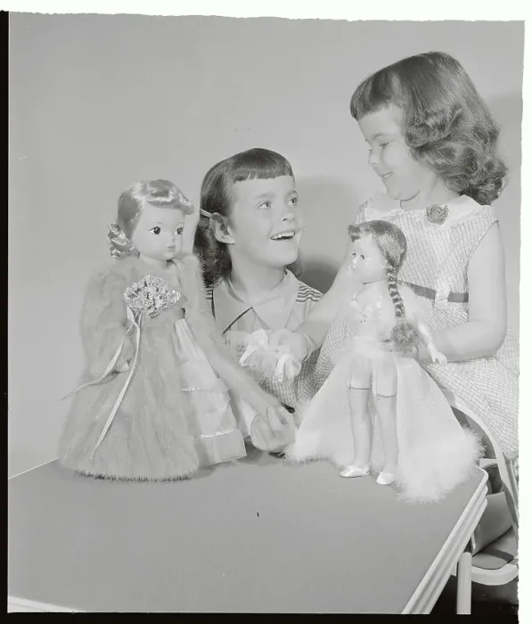 Framed Print : Girls Playing with Dolls Wearing Stockings and Mink Coat Framed Print : Girls Playing with Dolls Wearing Stockings and Mink Coat