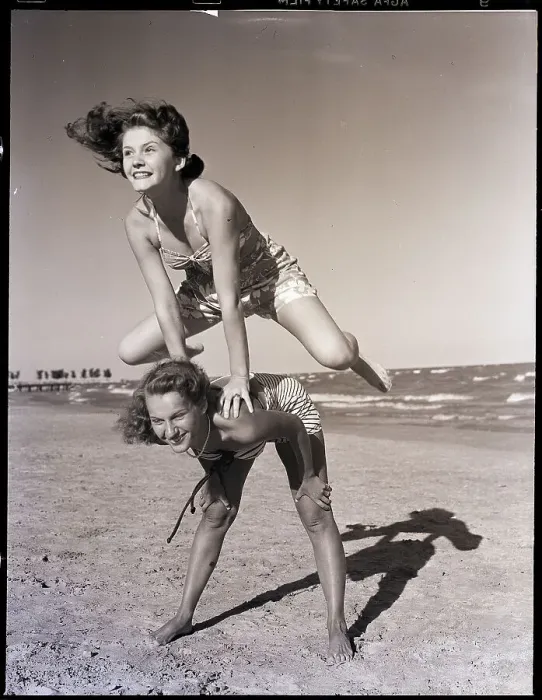 Framed Print : Girls Playing Leapfrog on Beach