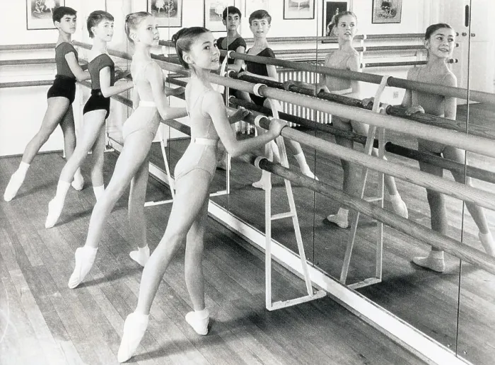 Framed Print : Girls Practicing with Balance Bar Framed Print : Girls Practicing with Balance Bar