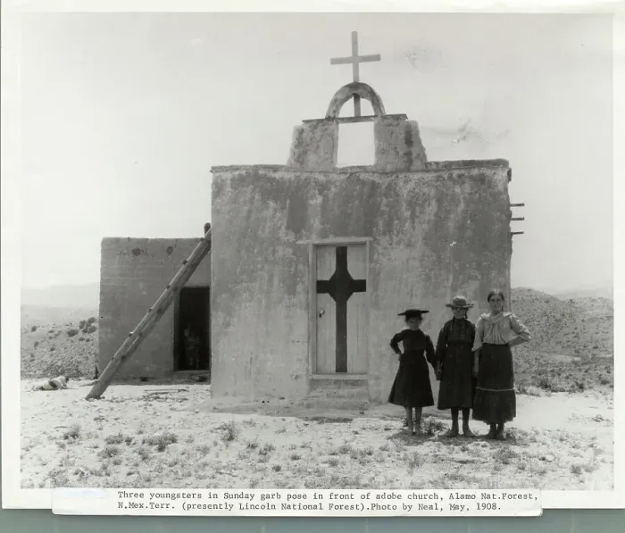 Framed Print : Girls Standing Near Door of Church