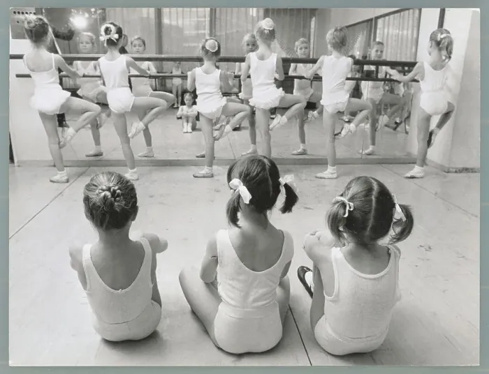 Framed Print : Girls Watching Classmates Exercising at Bar Framed Print : Girls Watching Classmates Exercising at Bar