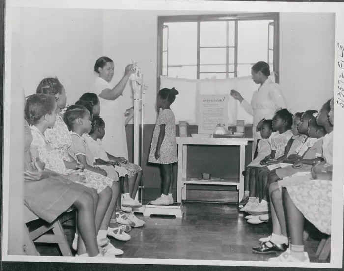 Framed Print : Girls Being Weighed In Framed Print : Girls Being Weighed In