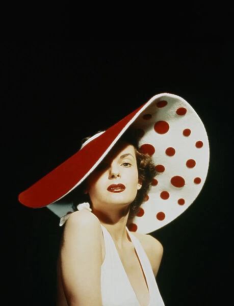 GLAMOROUS WOMAN IN A LARGE RED AND WHITE HAT
