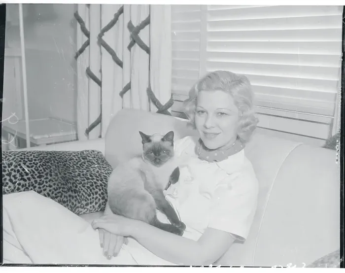 Framed Print : Glenda Farrell Holding Cat While Sitting on Couch Framed Print : Glenda Farrell Holding Cat While Sitting on Couch