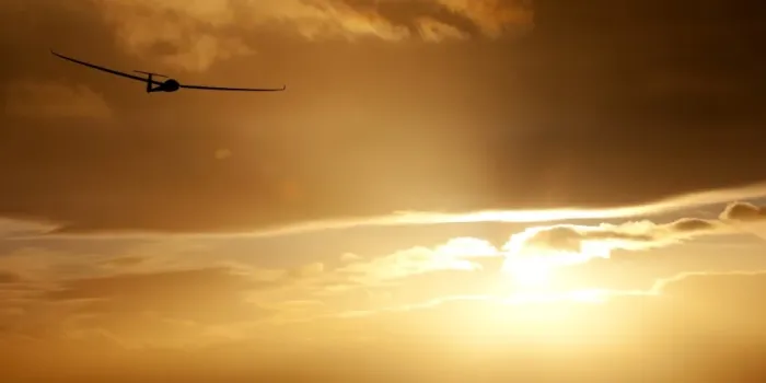 Framed Print : Glider at sunset