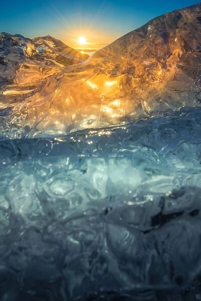 Glowing iceberg from sunrise