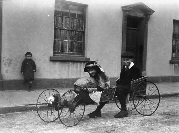Go-Cart. circa 1910: Children riding on a go-cart, in Swansea
