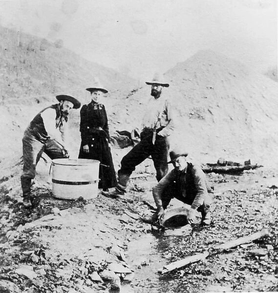 Gold Rush. Full-length image of three men and a woman standing
