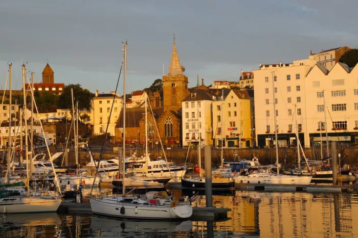 Framed Print : Golden early morning light shines on St Peter Port Framed Print : Golden early morning light shines on St Peter Port