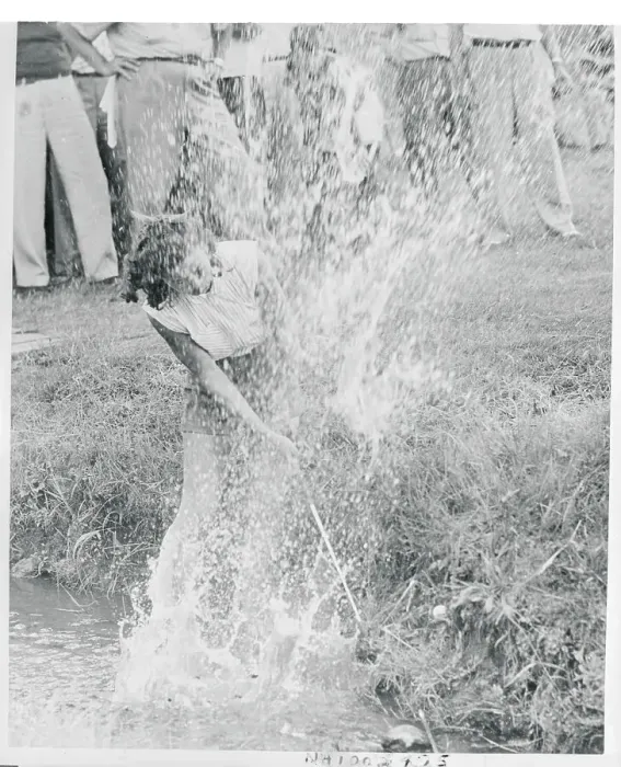 Framed Print : Golf Player Hitting Ball Out of a Creek